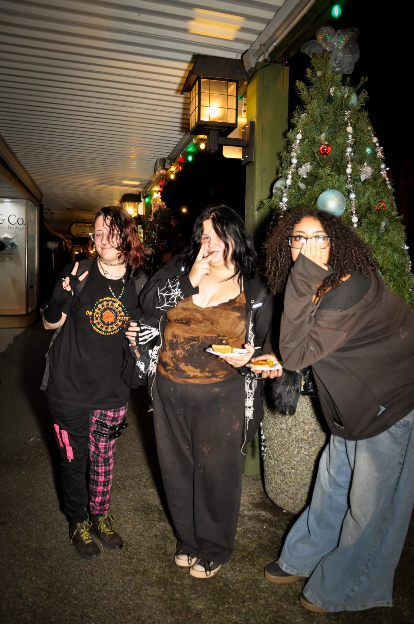 Thanksgiving-3 Three young women laugh outside of the drop in center.